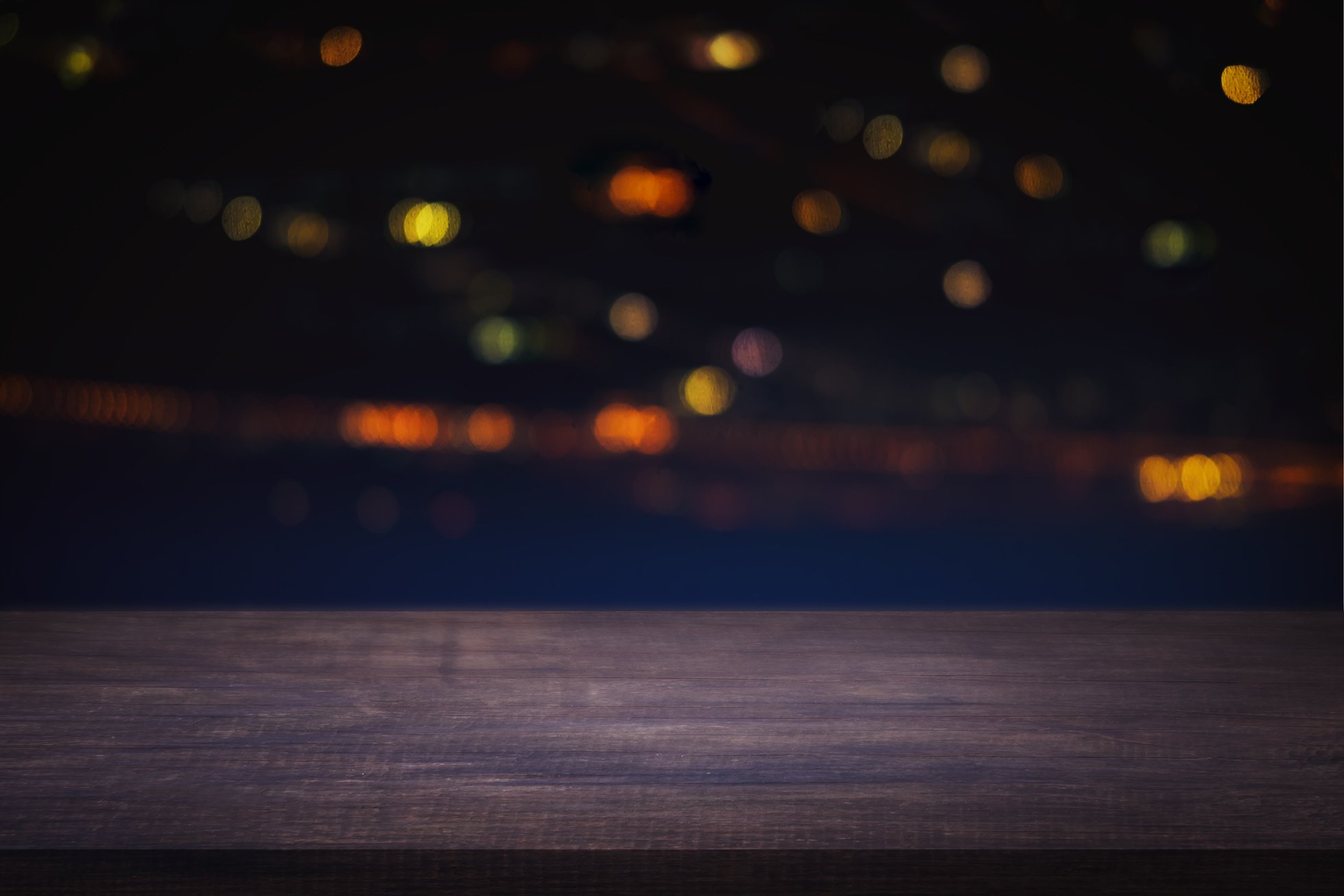 Empty Wooden Table with Blurred City Night Background